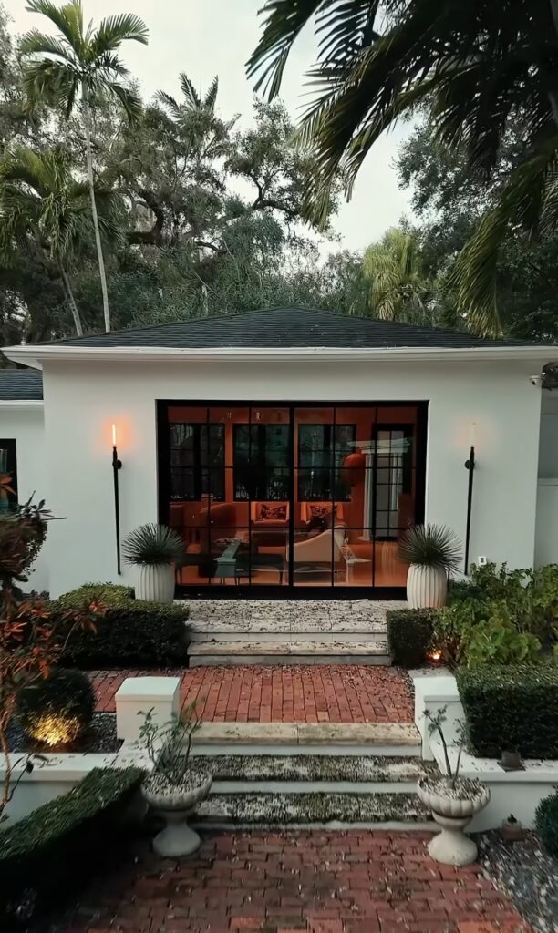 Exterior photo of a luxury South Florida home with impact windows installed