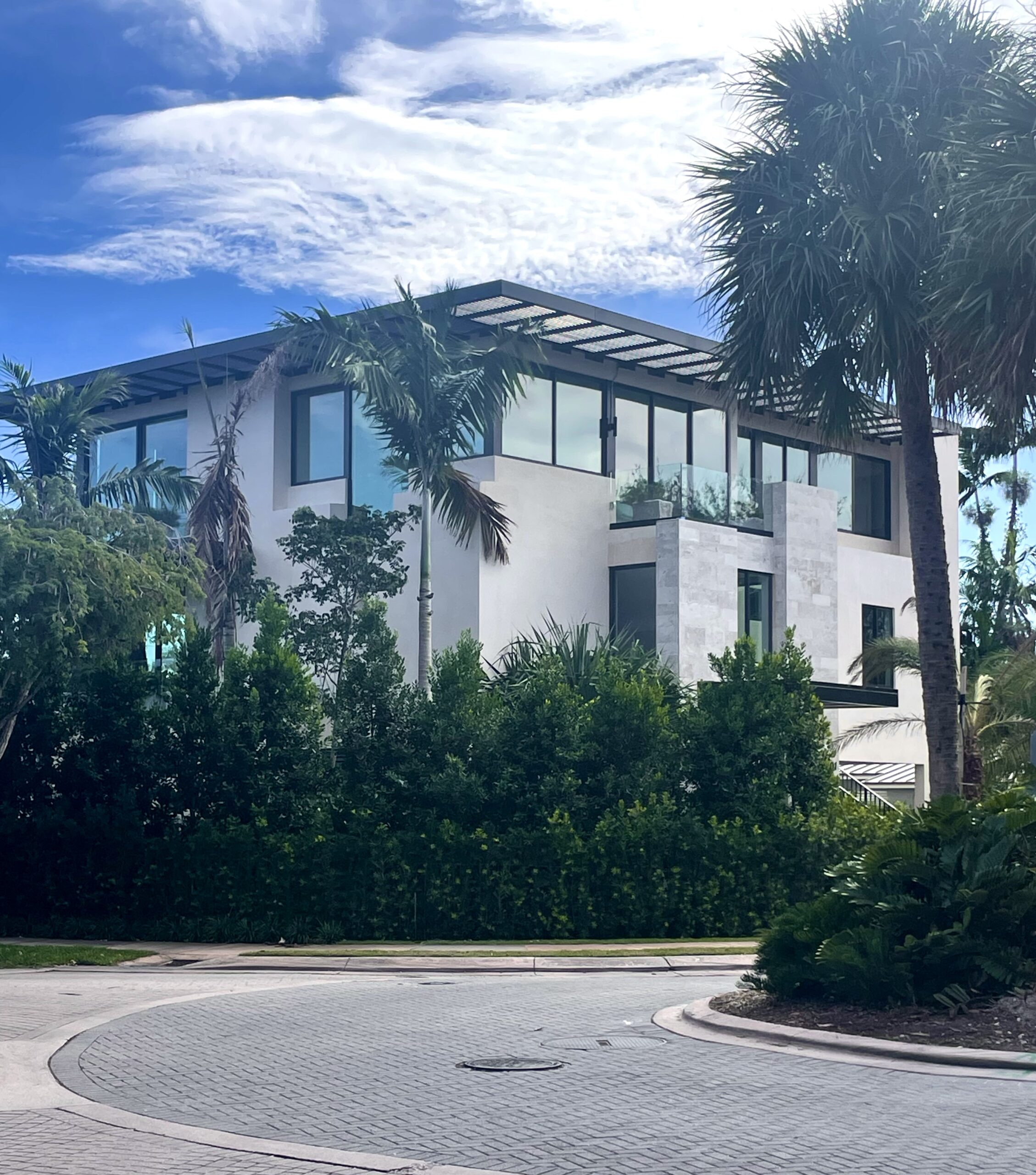 Street side view photo of a modern Florida home outfitted with impact windows and doors